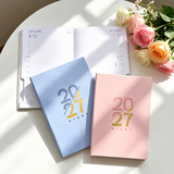 Pink and light blue 2027 diaries without names